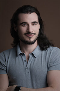 Image is a headshot of Asher Gelman