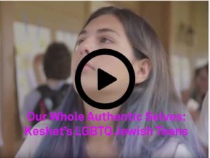 Image is a still from a video that shows a young person with purple hair. Pink text on the bottom of the image reads "Our Whole Authentic Selves: Keshet's LGBTQ Jewish Teens."