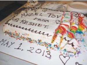 Image of a cake that reads: "Mazel Tov from Keshet: May 1, 2013"