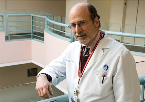 Image of Dr. Norman Spack in a white lab coat.