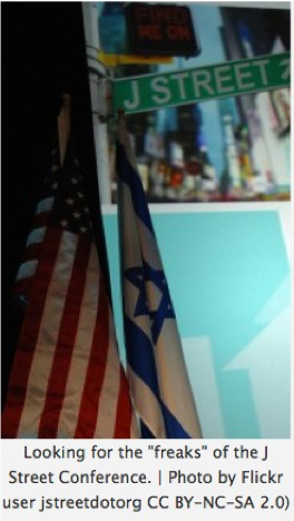 Image of street sign reading "J Street" alongside the American and Israeli flags.