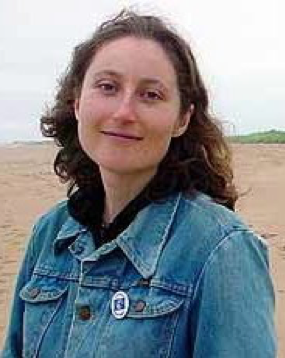 Image of Irena Fayngold standing outside in a blue jean jacket.