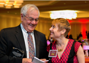 Image of Idit Klein standing with Barney Frank, smiling.