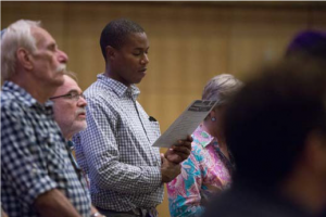 Image of four people gathered at Boston's Temple Israel.