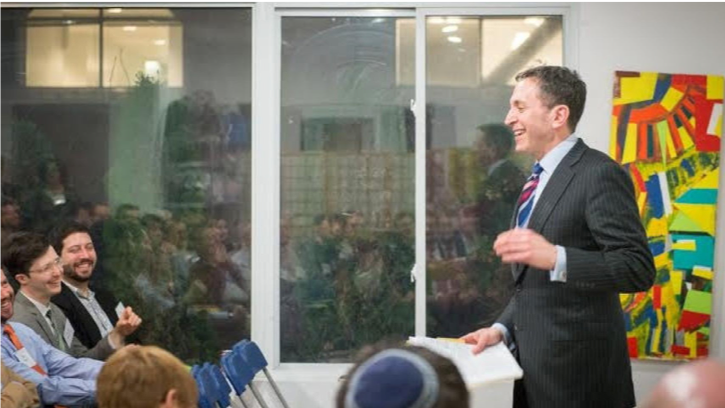 Image of Matt Nosanchuk speaking in front of several people.