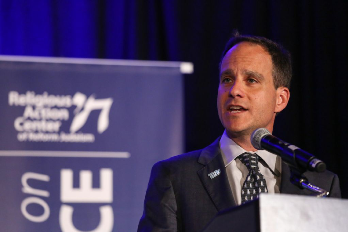 Image of Rabbi Jonah Dov Pesner speaking at a podium with a microphone.