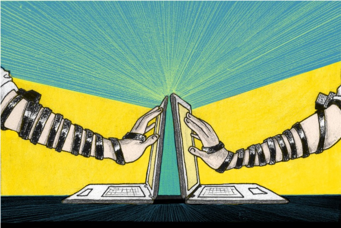 Image of two different outstretched hands reached towards two different computer screens. Both arms are wearing tefillin.