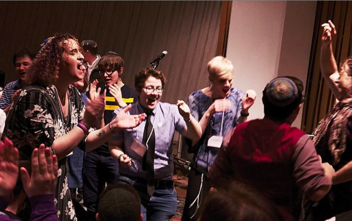 Image of a group of people dancing.