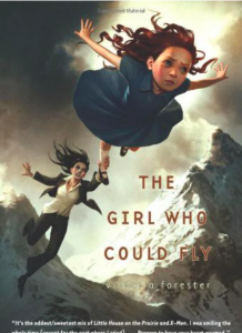 Cover of "The Girl Who Could Fly." it shows a young girl flying over the mountains with a lady in a suit grabbing onto her ankle.