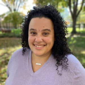 An image of a Black Jewish woman smiling