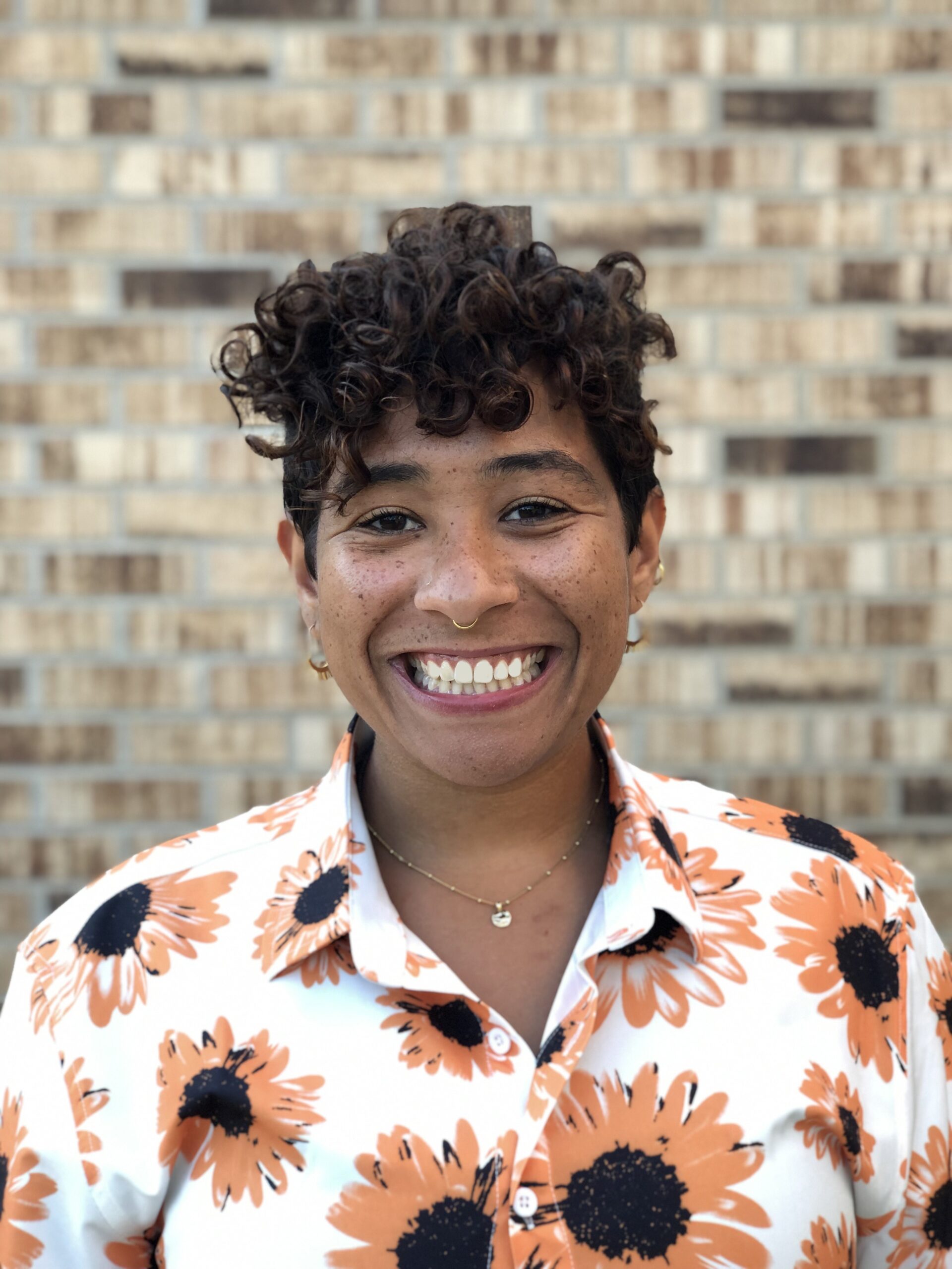 An image of a Black Jewish woman smiling