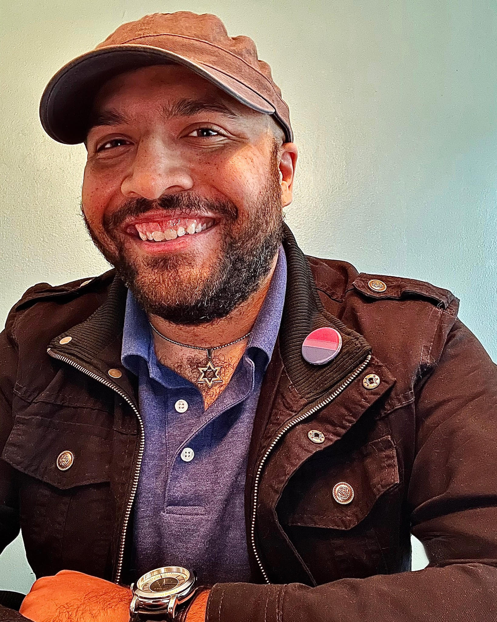 A Black Jewish man smiling