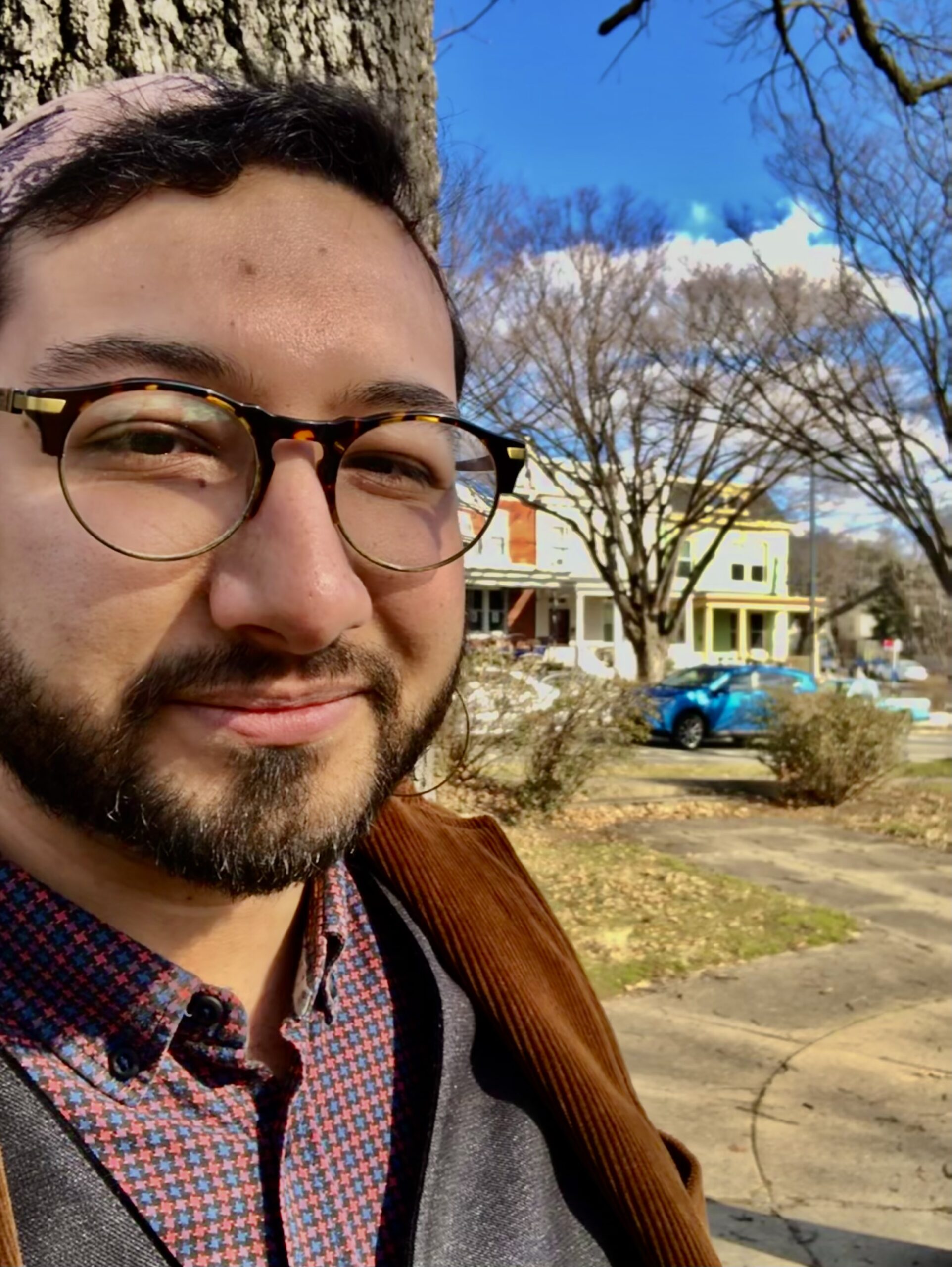 A person with a kippah, beard and glasses