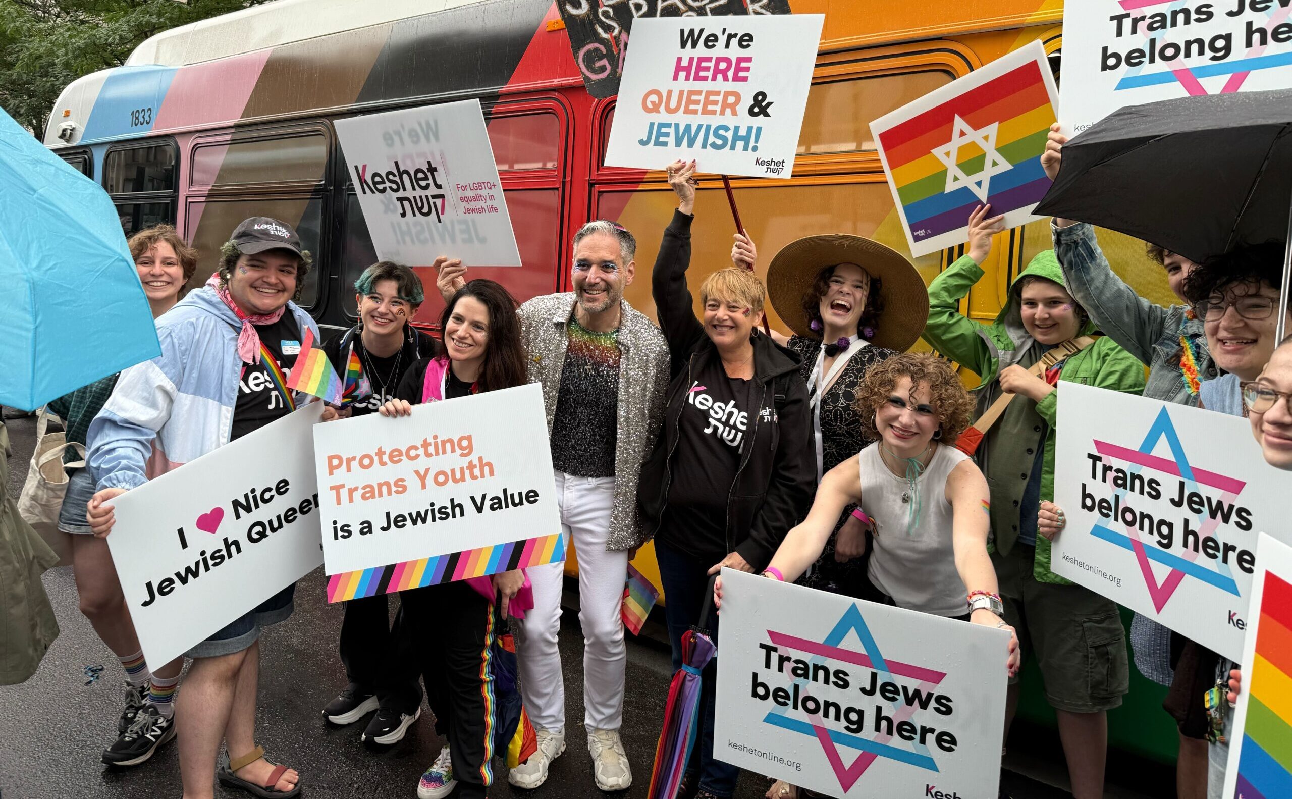 Idit Klein, Jaimie KRass, and friends of KEshet holding pride signs